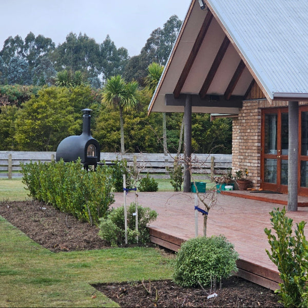 wooden deck and a brick oven