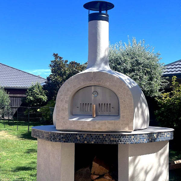 Outdoor stone pizza oven with wood storage